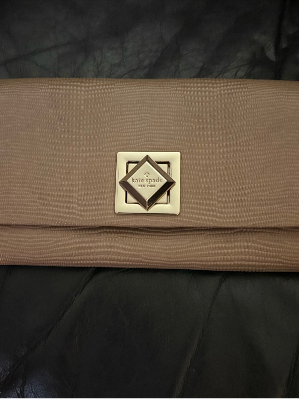 Authentic kate spade Tan fold-over wallet with gold logo claps, logo on zipper.